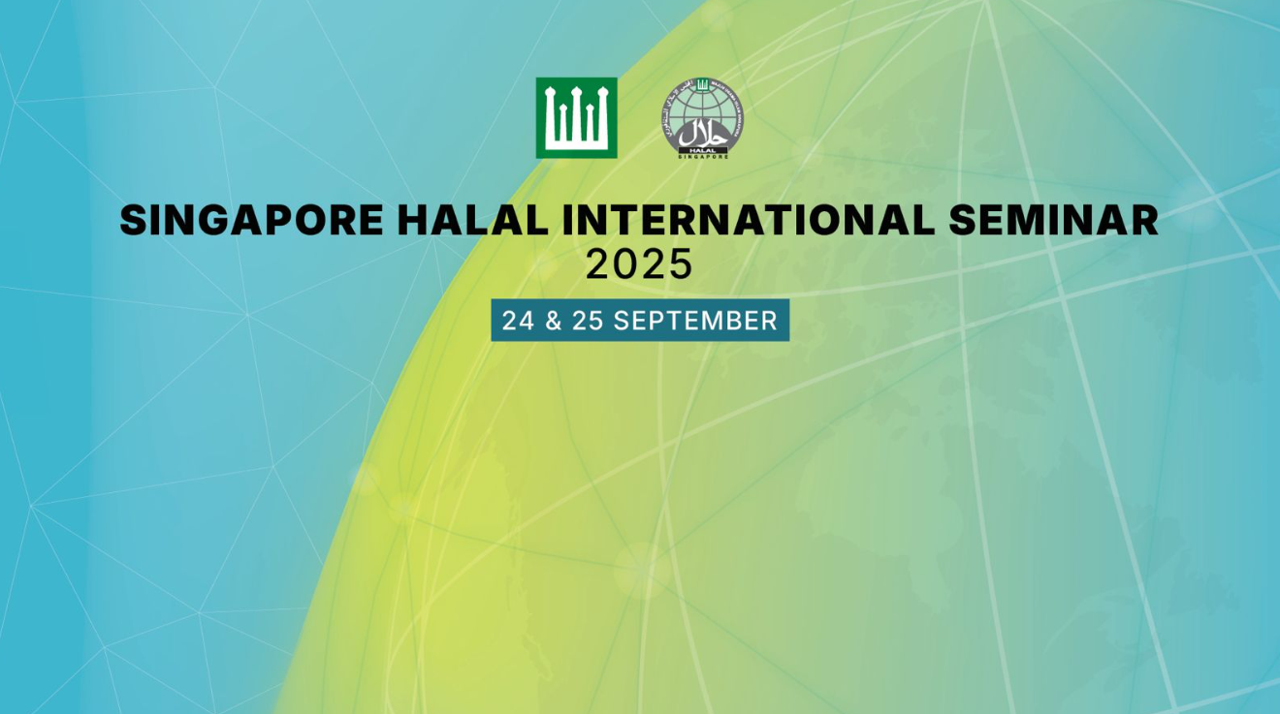 A modern conference hall filled with people.